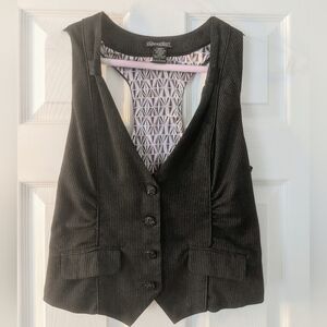 Woman's black pinstripe vest